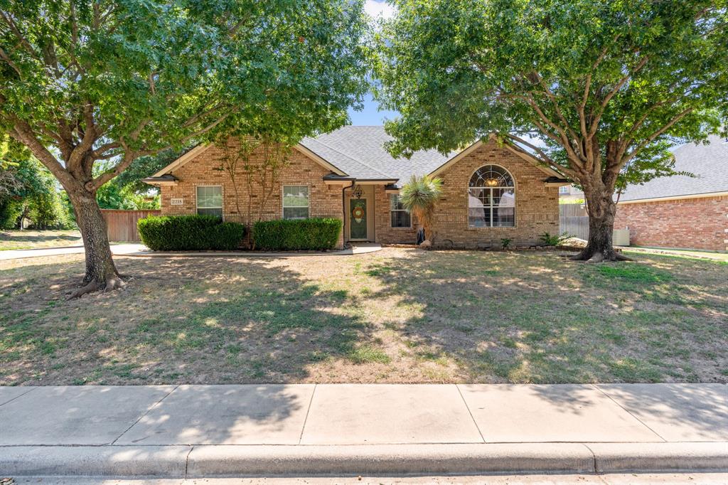 2218 Quail Ridge Drive Weatherford, TX 76087 - Photo 1 of 1 View of front of house with a front yard