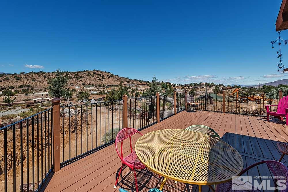 15850 Rocky Vista Road Reno, NV 89521 - Photo 20 of 40 a view of a balcony with wooden floor and city view