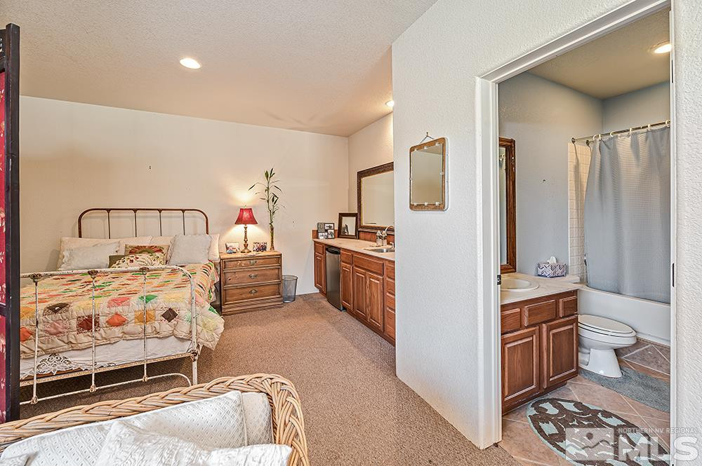 15850 Rocky Vista Road Reno, NV 89521 - Photo 23 of 40 a bedroom with a bed and a cabinets
