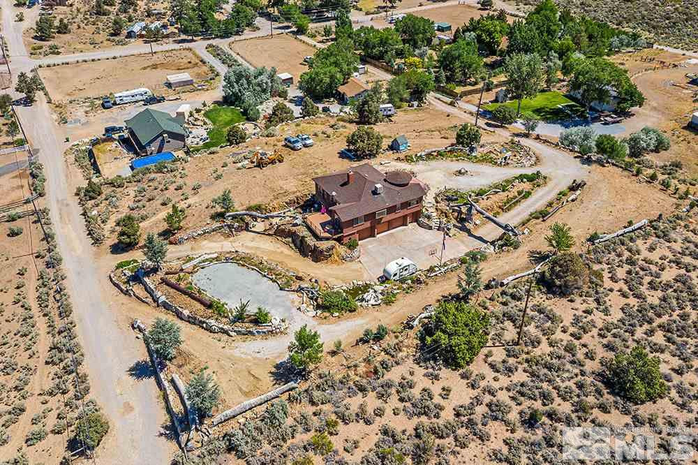 15850 Rocky Vista Road Reno, NV 89521 - Photo 38 of 40 an aerial view of a house with a yard and large trees