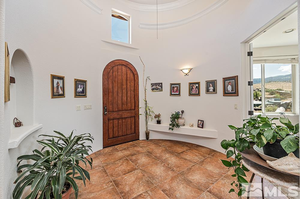 15850 Rocky Vista Road Reno, NV 89521 - Photo 4 of 40 a bedroom with furniture and a potted plant
