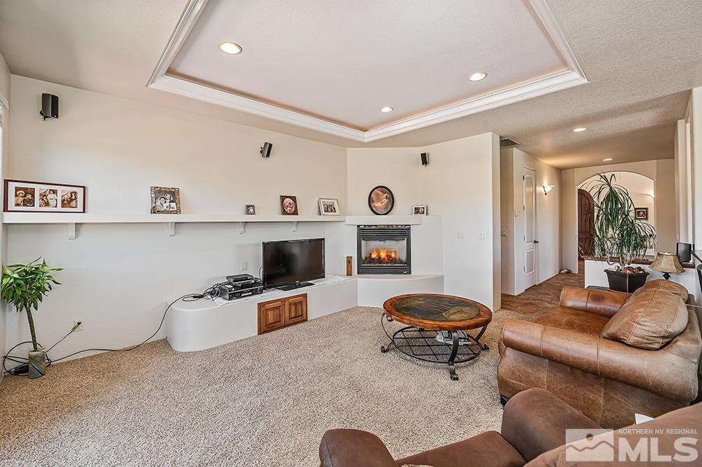 15850 Rocky Vista Road Reno, NV 89521 - Photo 7 of 40 a living room with furniture and a fireplace