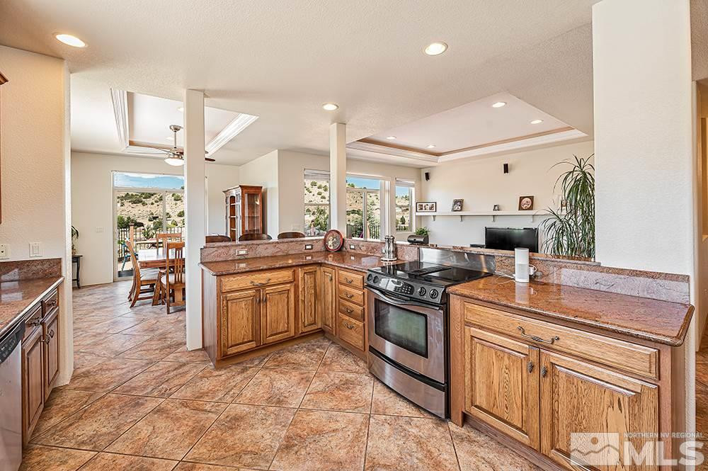 15850 Rocky Vista Road Reno, NV 89521 - Photo 10 of 40 a kitchen with stainless steel appliances granite countertop a sink and cabinets