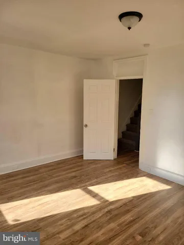 a view of a livingroom with wooden floor