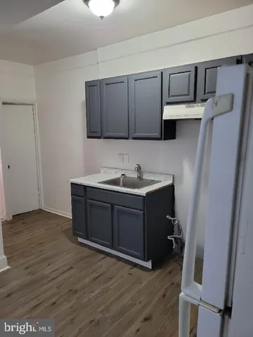 a room with a cabinets and a wooden floor