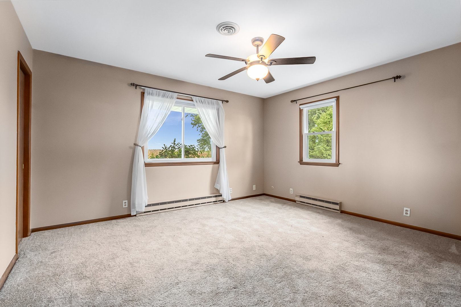 14255 Grove Road Minooka, IL 60447 - Photo 8 of 38 an empty room with windows and fan