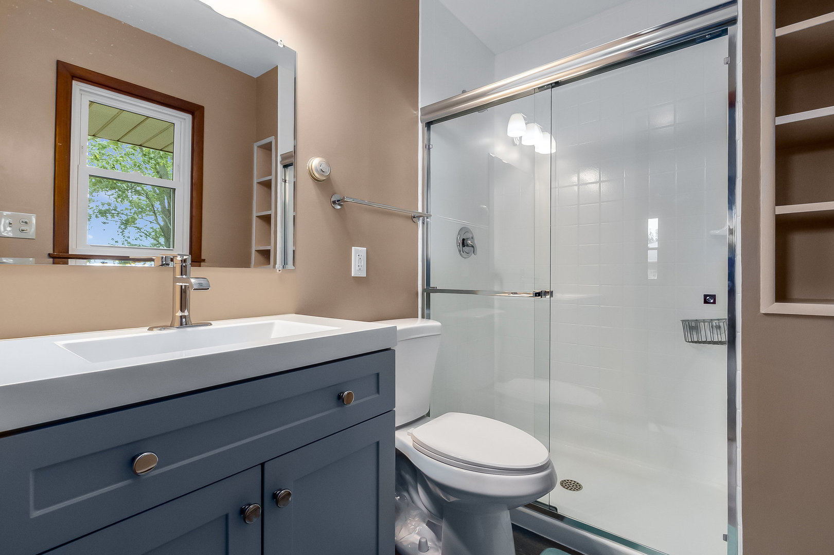 14255 Grove Road Minooka, IL 60447 - Photo 9 of 38 a bathroom with a sink a toilet a mirror and shower