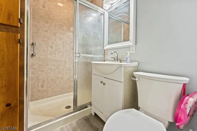 a white toilet sitting next to a bathroom sink
