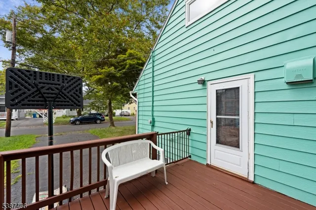 a view of a wooden deck with a bench