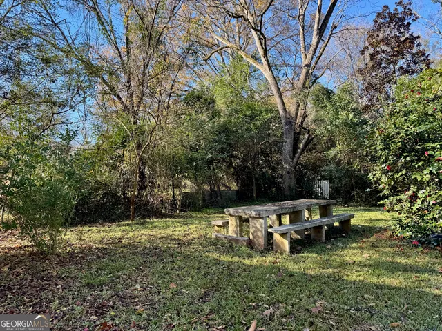 a kitchen with a table and chairs in it
