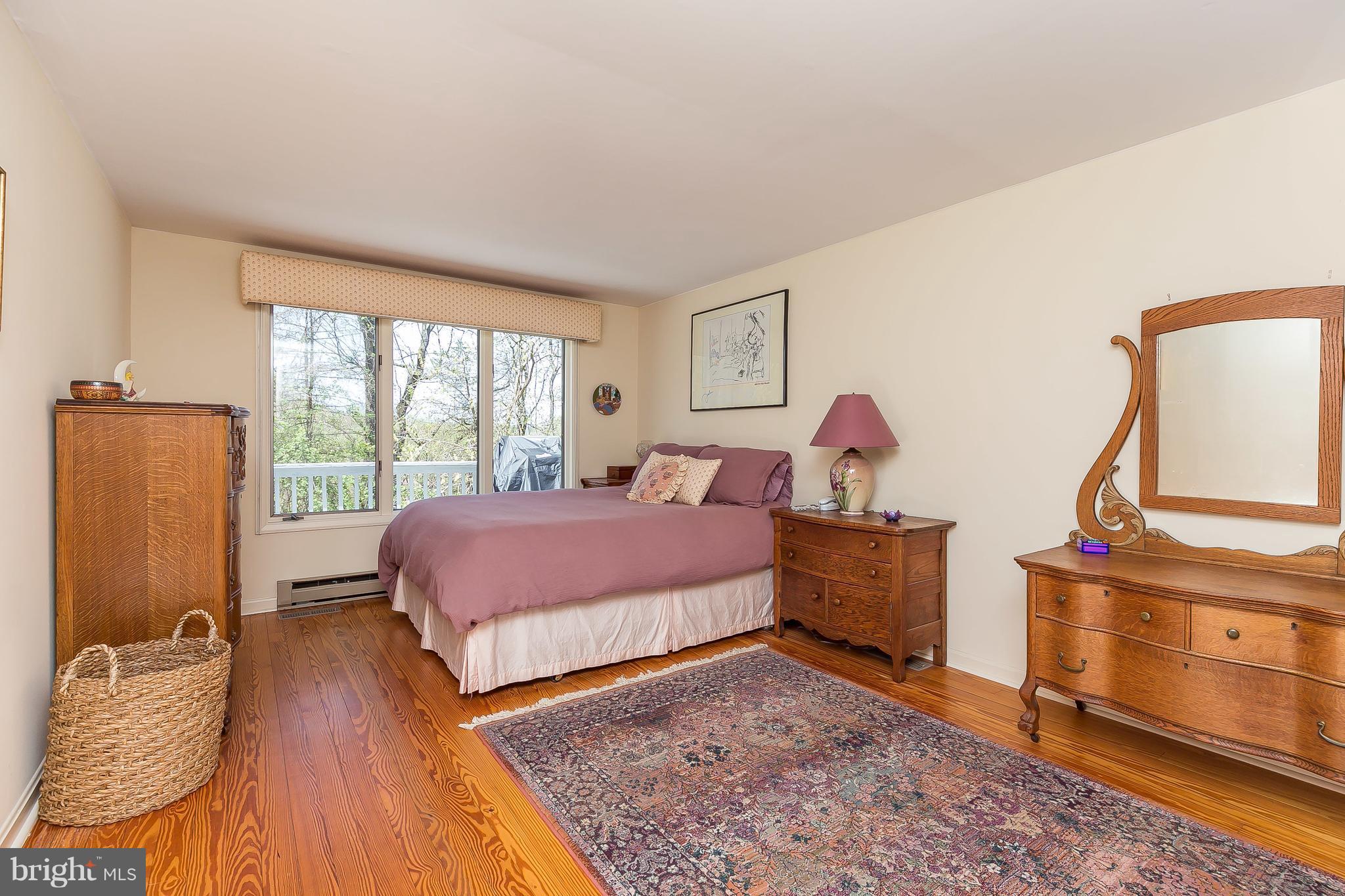 1801 Blue Mt Road Monkton, MD 21111 - Photo 11 of 30 a spacious bedroom with a bed and wooden floor