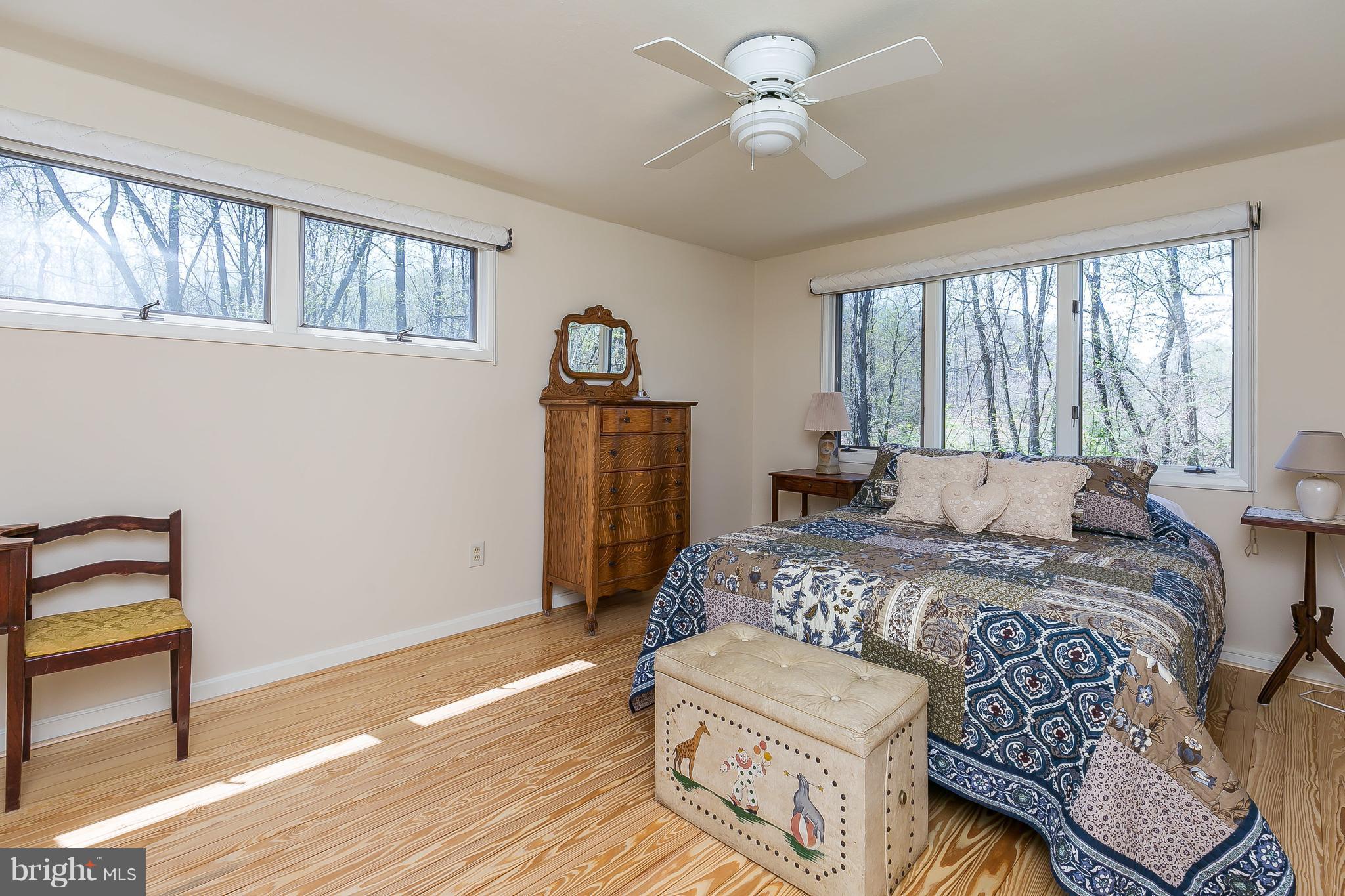 1801 Blue Mt Road Monkton, MD 21111 - Photo 15 of 30 a bedroom with a bed and a chandelier