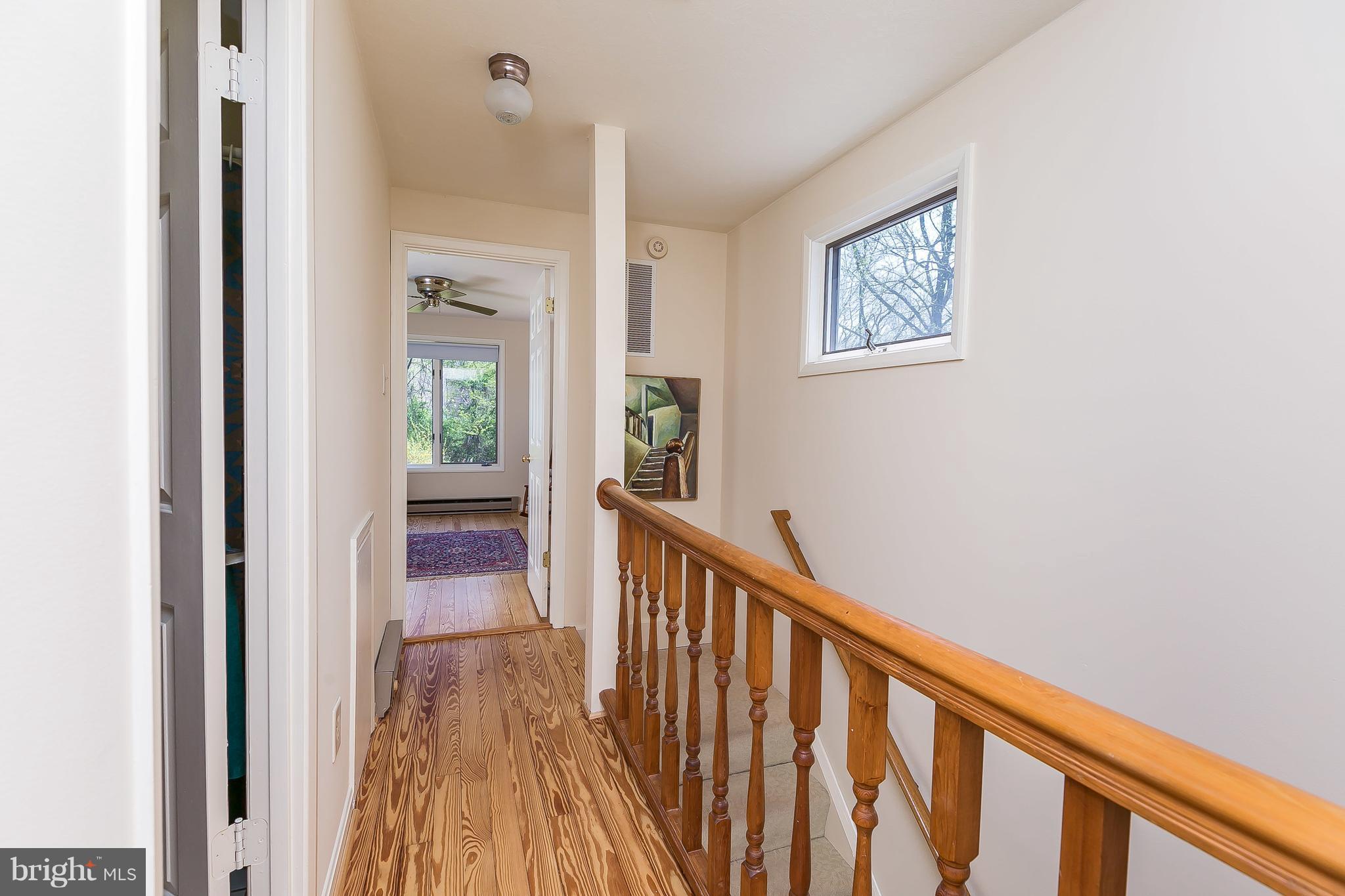 1801 Blue Mt Road Monkton, MD 21111 - Photo 17 of 30 a view of a hallway with wooden floor and a bathroom
