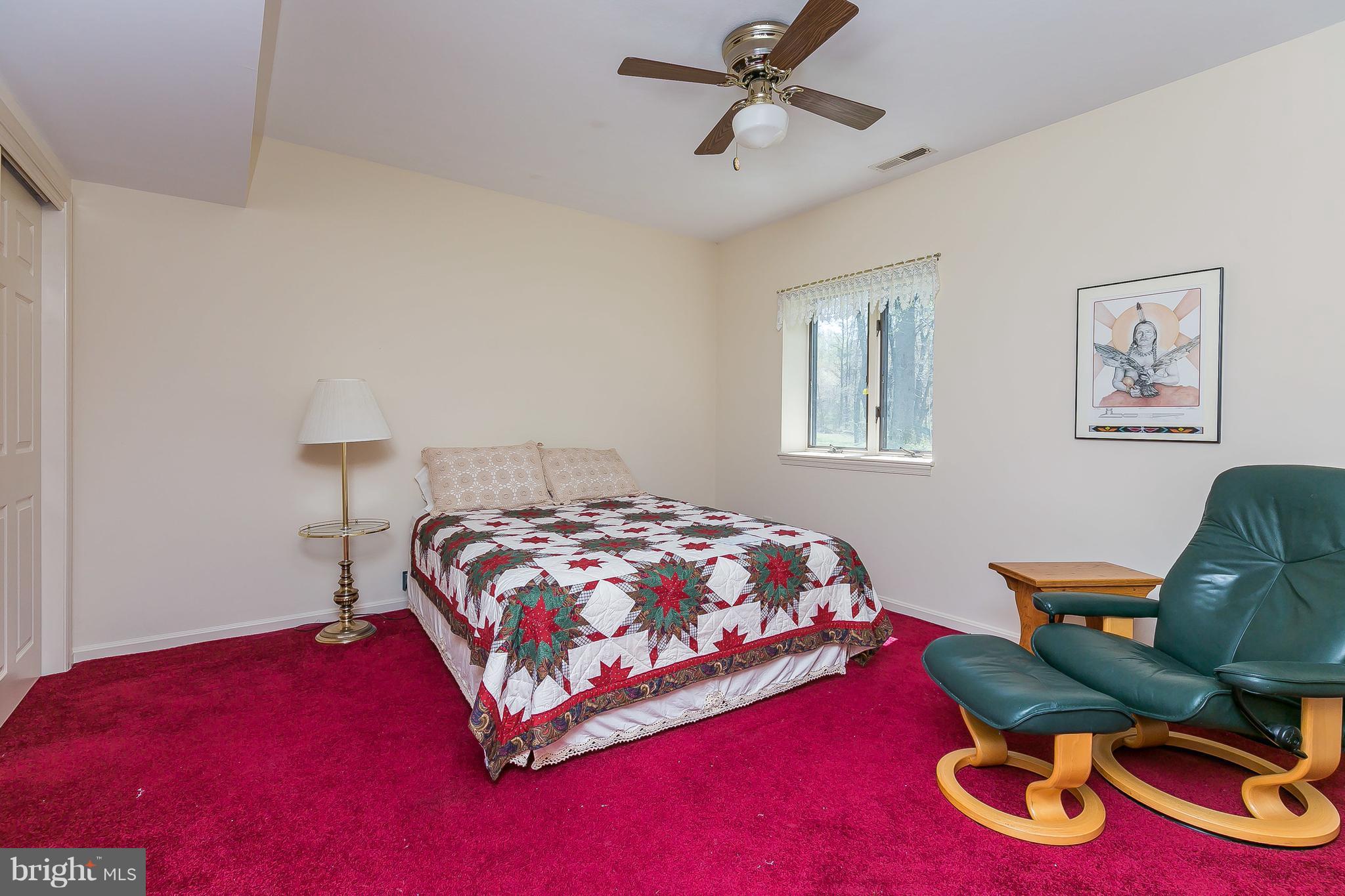 1801 Blue Mt Road Monkton, MD 21111 - Photo 21 of 30 a bedroom with a bed and a chair
