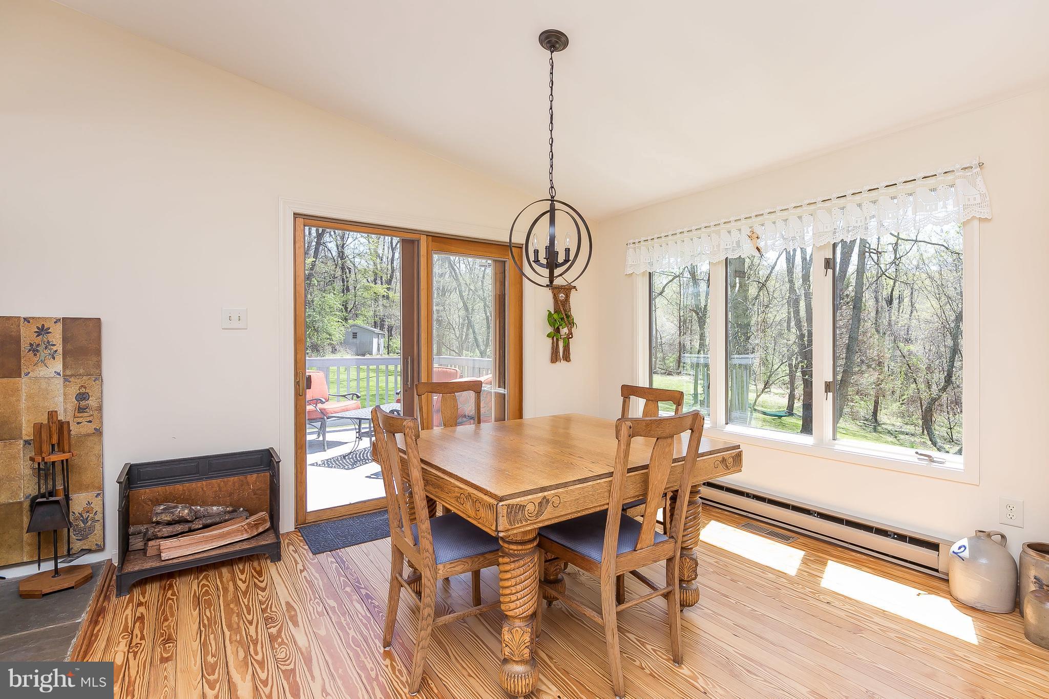 1801 Blue Mt Road Monkton, MD 21111 - Photo 7 of 30 a view of a dining room with furniture window and wooden floor