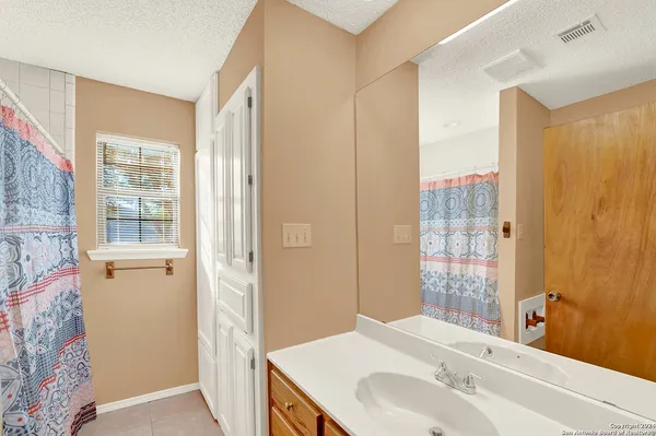 a bathroom with a sink and a shower