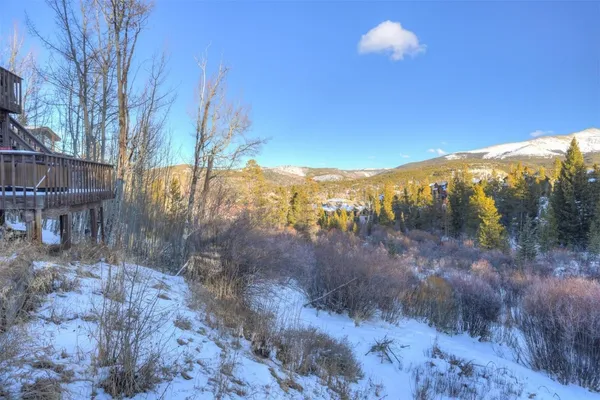 a view of a yard with a mountain