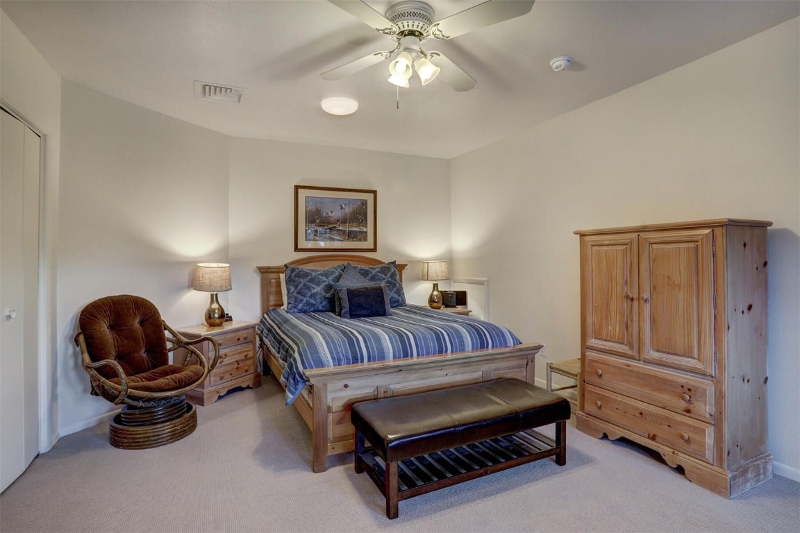 965 4 O Clock Road Breckenridge, CO 80424 - Photo 18 of 32 a bedroom with bed and a chandelier