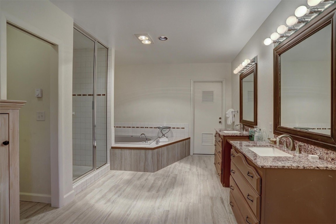965 4 O Clock Road Breckenridge, CO 80424 - Photo 28 of 32 a bathroom with a granite countertop double vanity sink a mirror and a bathtub