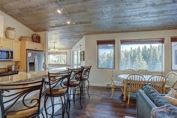 a view of a dining room with furniture window and outside view