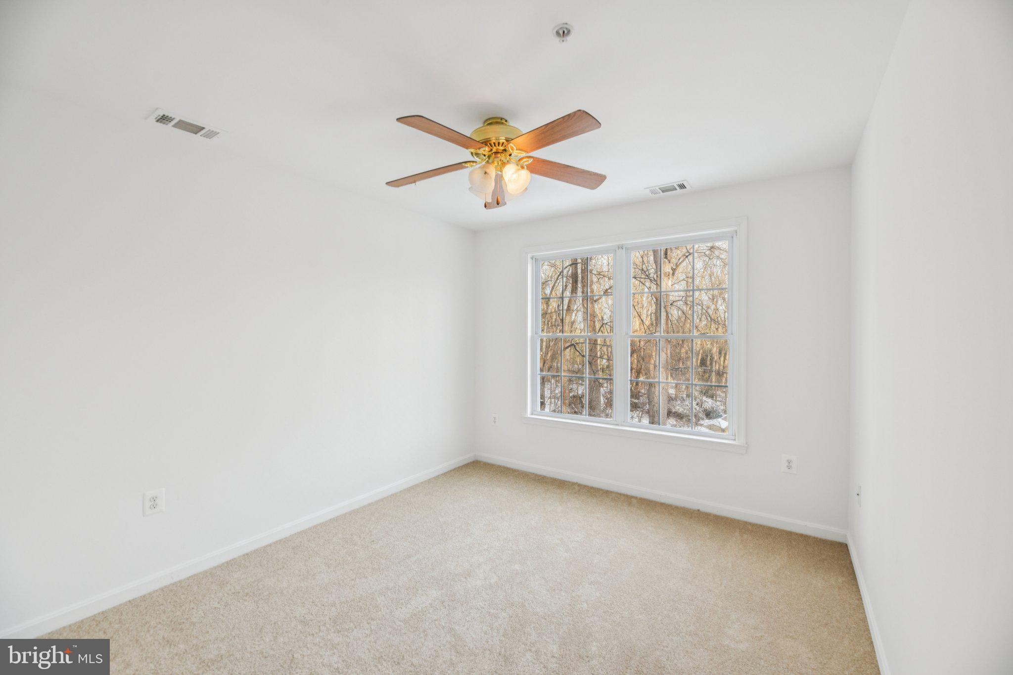 205 Captain Brendt Drive Accokeek, MD 20607 - Photo 18 of 37 an empty room with windows and fan