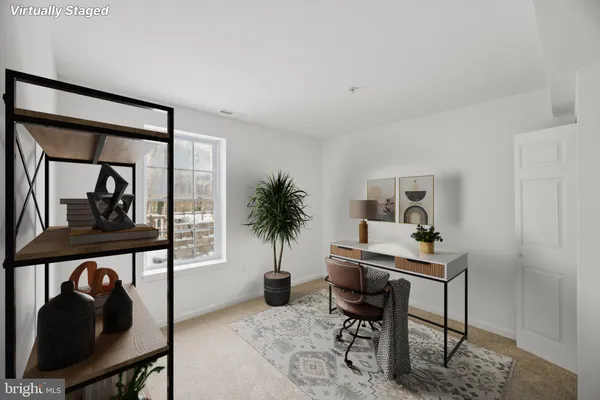 a workspace with furniture window and wooden floor