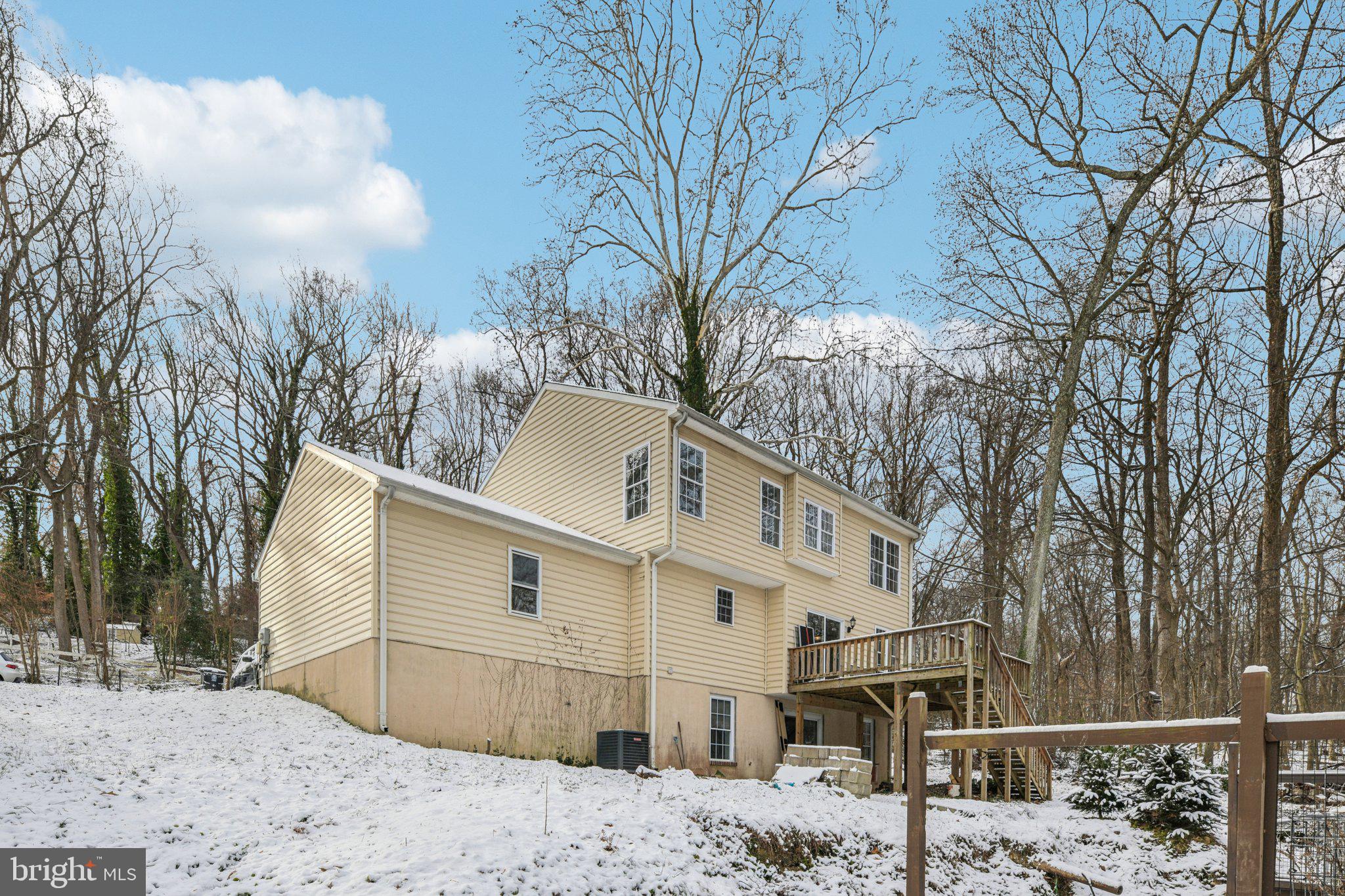 205 Captain Brendt Drive Accokeek, MD 20607 - Photo 32 of 37 a view of a white house with a snow on the road