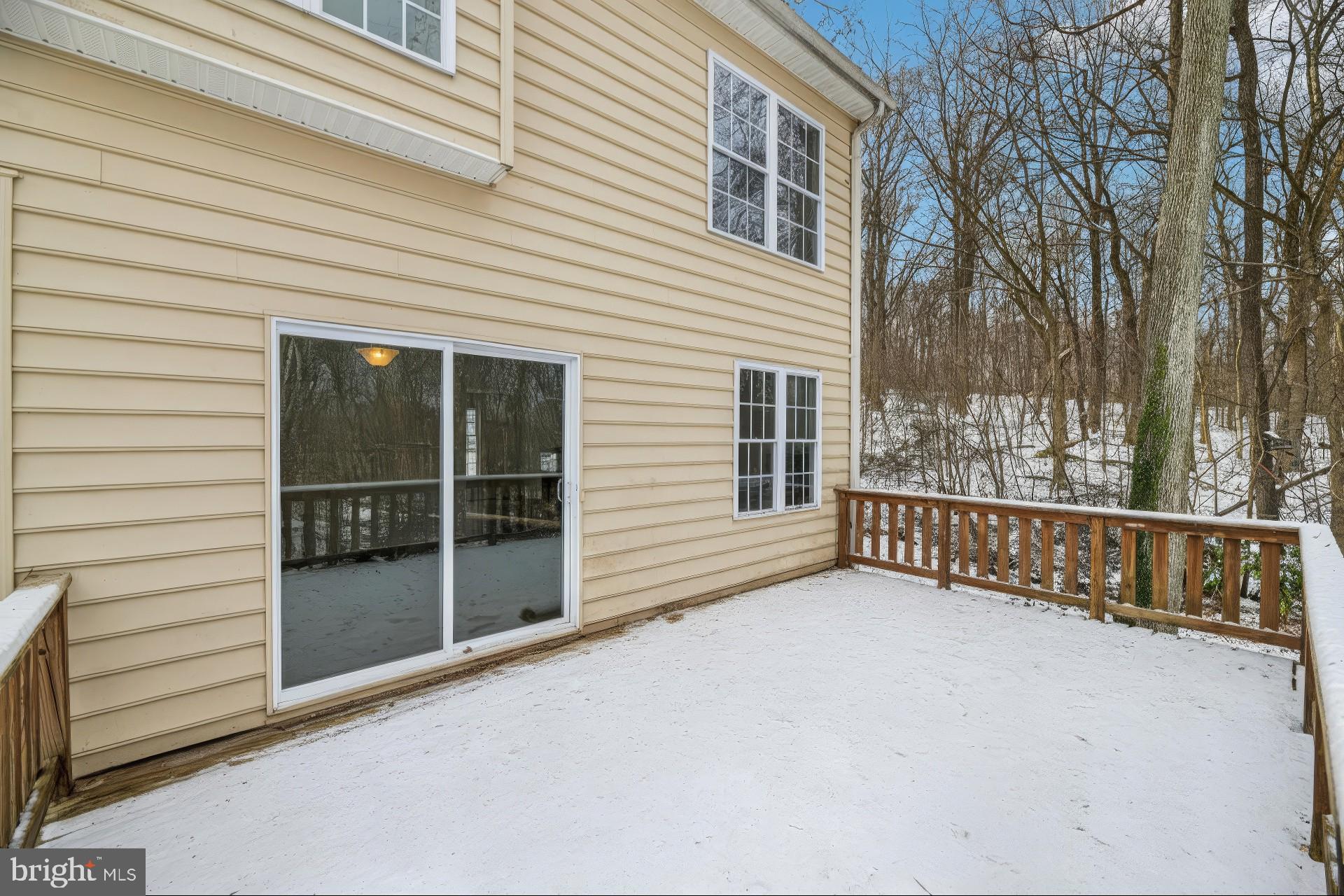 205 Captain Brendt Drive Accokeek, MD 20607 - Photo 33 of 37 a view of a porch with wooden floor and fence and a floor to ceiling window