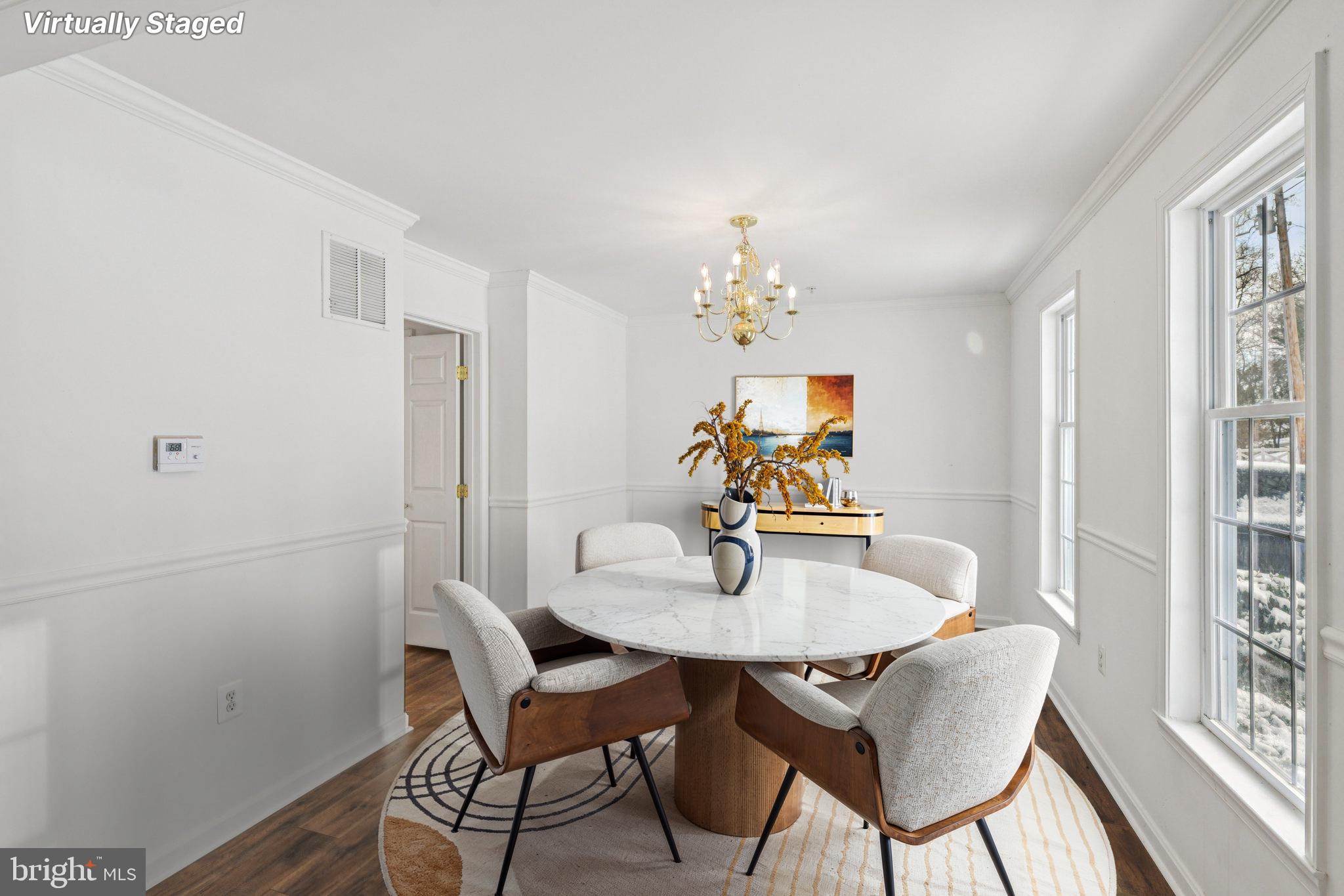 205 Captain Brendt Drive Accokeek, MD 20607 - Photo 4 of 37 a dining room with furniture a rug and a mirror
