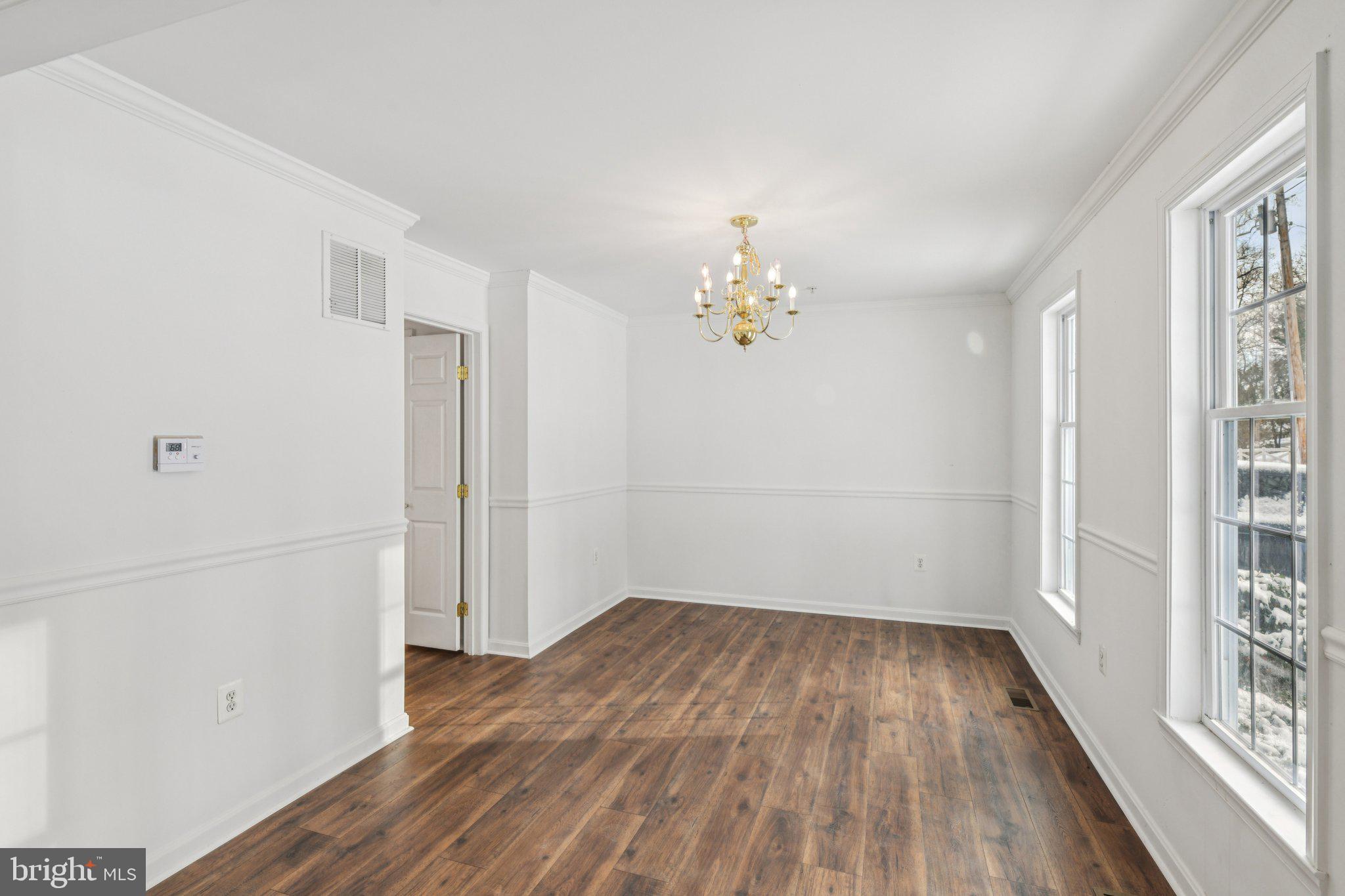 205 Captain Brendt Drive Accokeek, MD 20607 - Photo 5 of 37 a view of empty room with wooden floor and fan