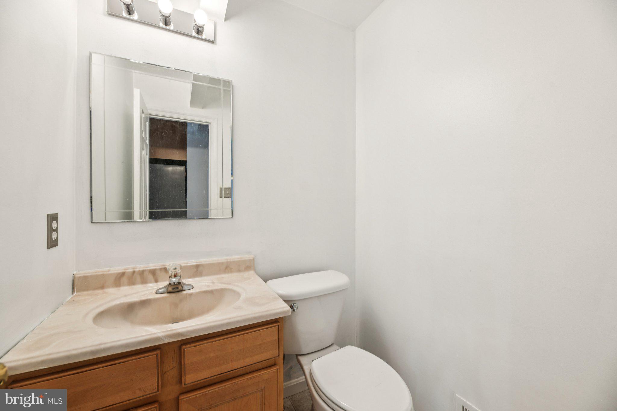 205 Captain Brendt Drive Accokeek, MD 20607 - Photo 10 of 37 a bathroom with a sink and a toilet