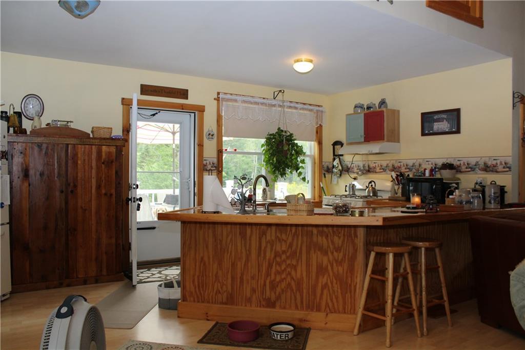 89 Pineo Point Road Harrington, ME 04643 - Photo 18 of 28 view of kitchen with deck in the...