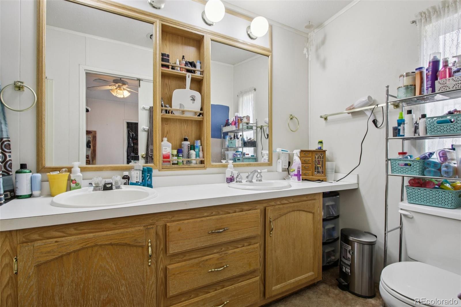81 Atlantis Road Black Hawk, CO 80422 - Photo 18 of 40 a bathroom with a sink and a mirror