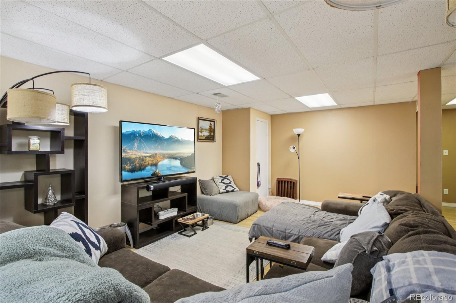 81 Atlantis Road Black Hawk, CO 80422 - Photo 19 of 40 a living room with furniture and a flat screen tv