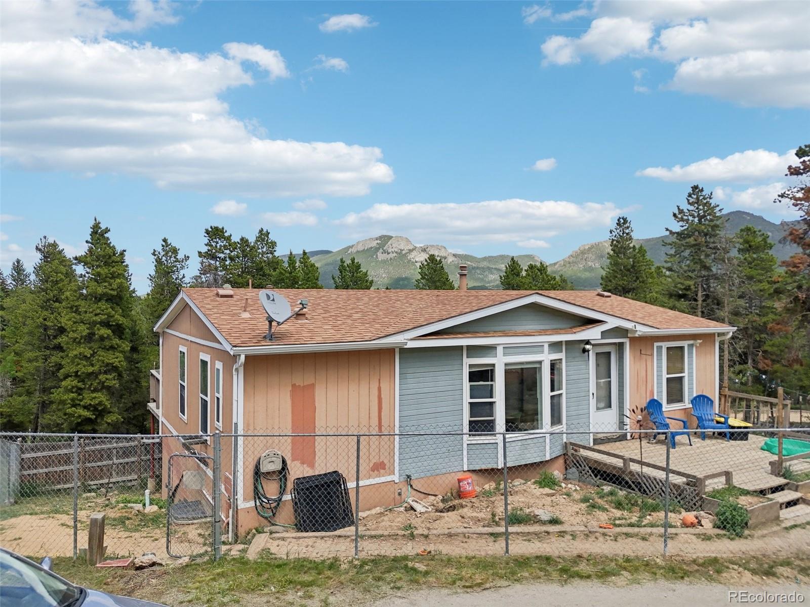 81 Atlantis Road Black Hawk, CO 80422 - Photo 38 of 40 a front view of a house with garden