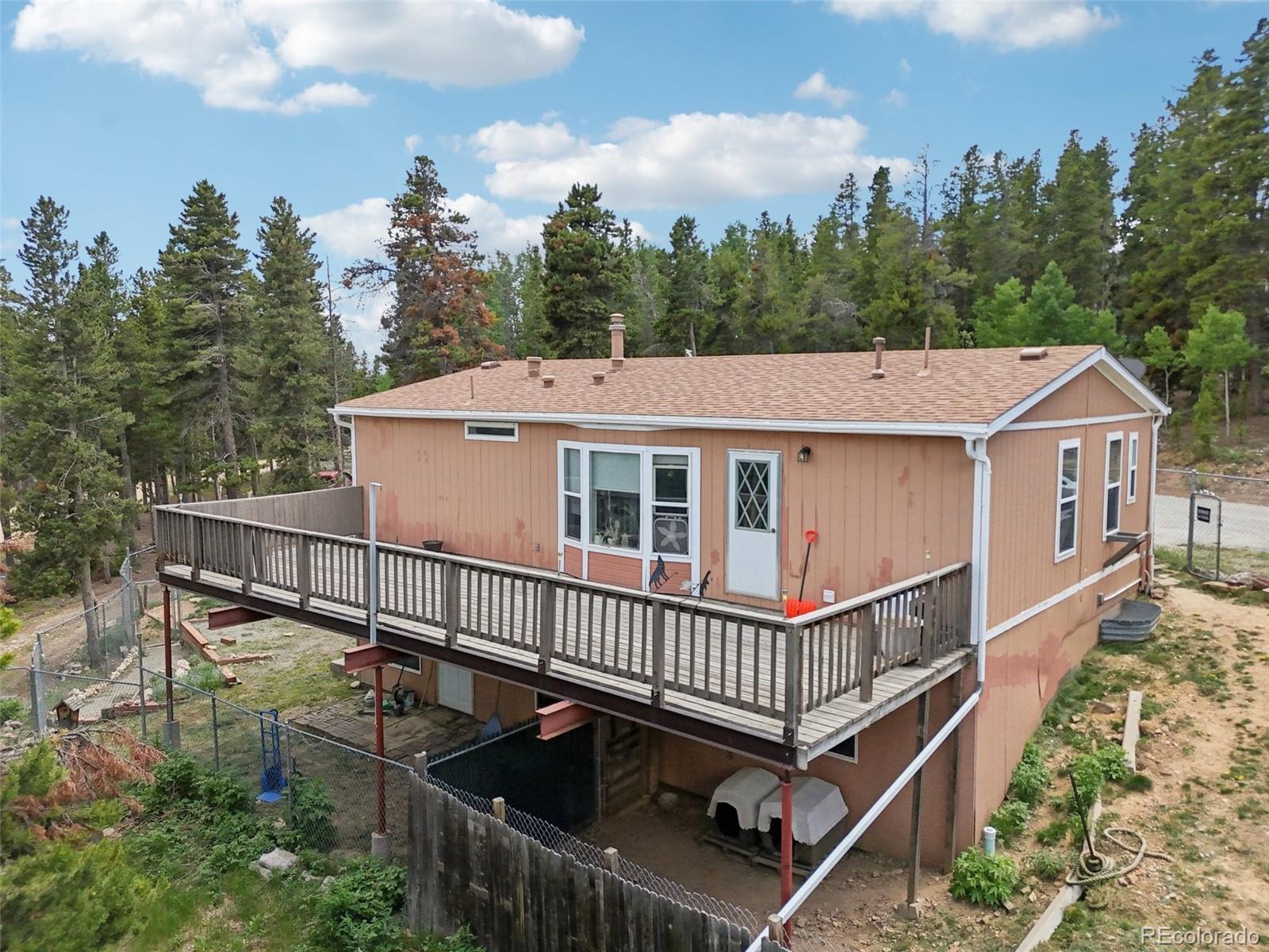 81 Atlantis Road Black Hawk, CO 80422 - Photo 39 of 40 aerial view of a house with a deck