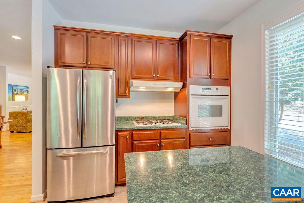 741 Dry Bridge Road Charlottesville, VA 22903 - Photo 12 of 37 a view of kitchen with stainless steel appliances granite countertop a refrigerator and a stove top oven