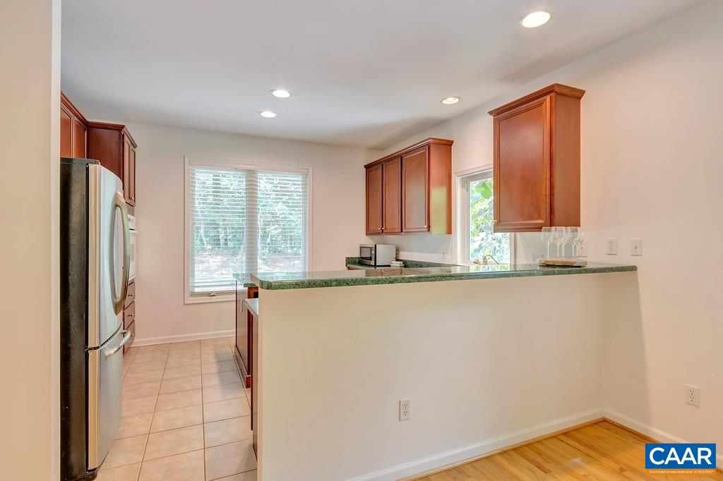 741 Dry Bridge Road Charlottesville, VA 22903 - Photo 14 of 37 a view of a kitchen with a refrigerator and wooden floor