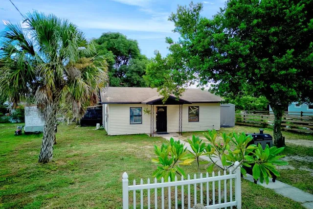 a house with a tree in front of it