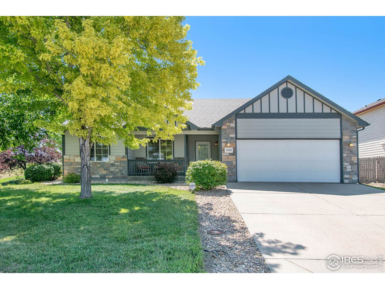 8300 18th St Road Greeley, CO 80634 - Photo 2 of 26 Covered stoop with mature shade tree