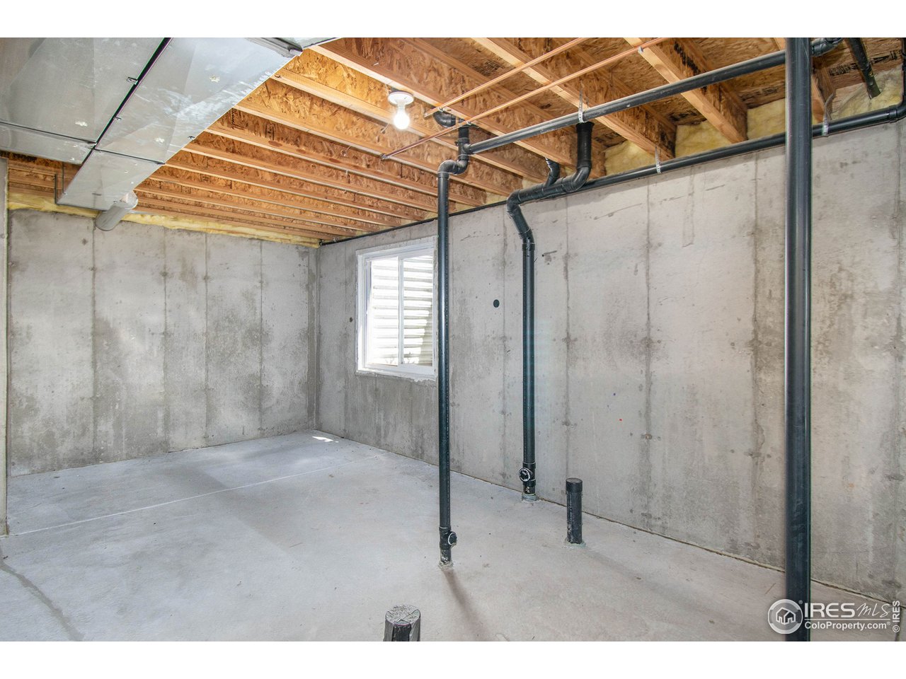 8300 18th St Road Greeley, CO 80634 - Photo 22 of 26 Basement Daylight Windows & Bath Rough-In