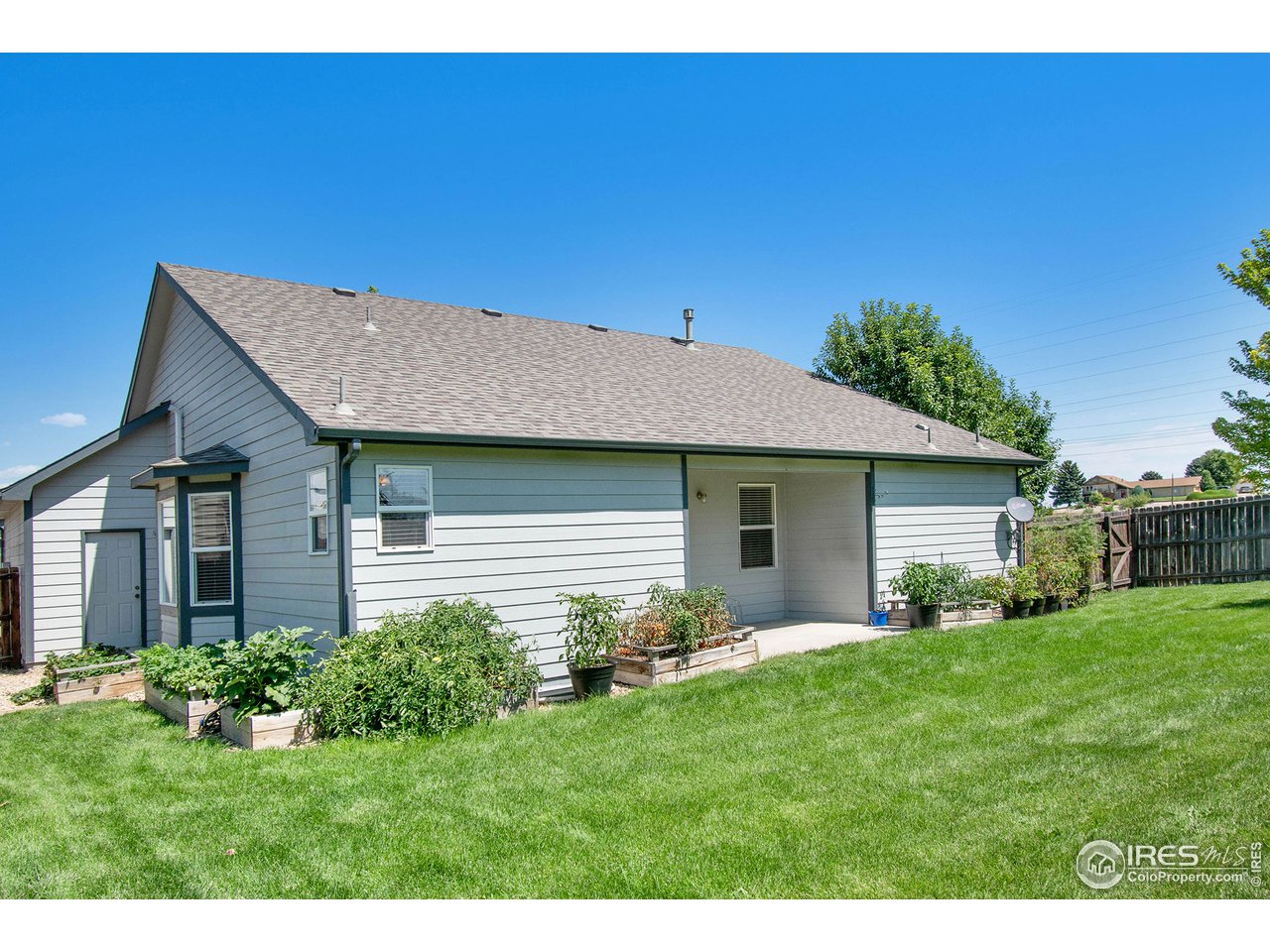 8300 18th St Road Greeley, CO 80634 - Photo 26 of 26 Backyard wraps around. Garden Boxes.