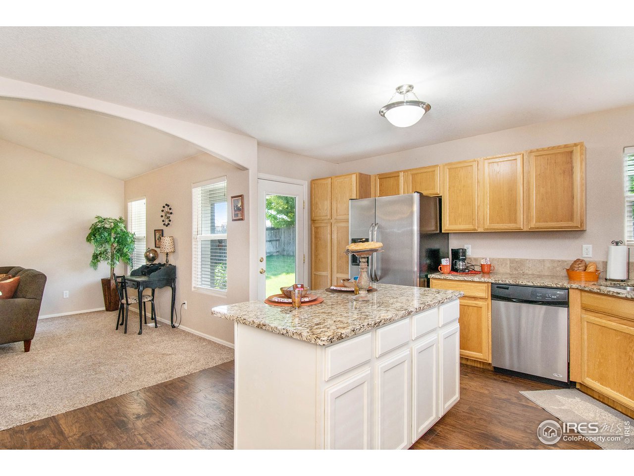 8300 18th St Road Greeley, CO 80634 - Photo 7 of 26 Granite counters & island open to Great Room