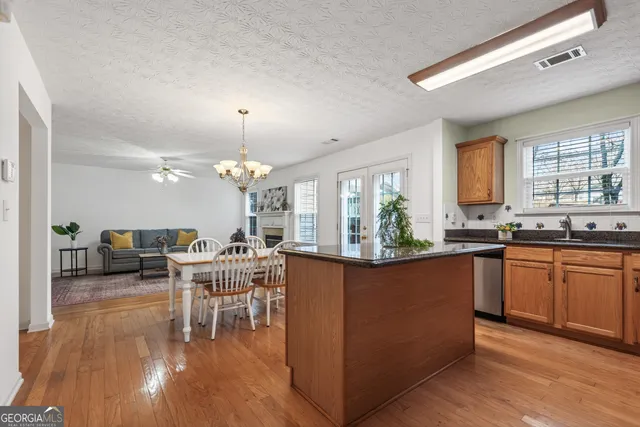 a kitchen with lots of counter top space and dining table