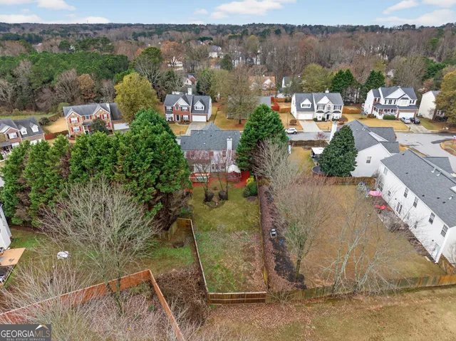 an aerial view of residential houses with outdoor space