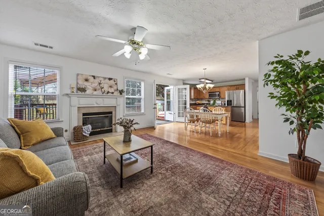 a living room with furniture and a fireplace