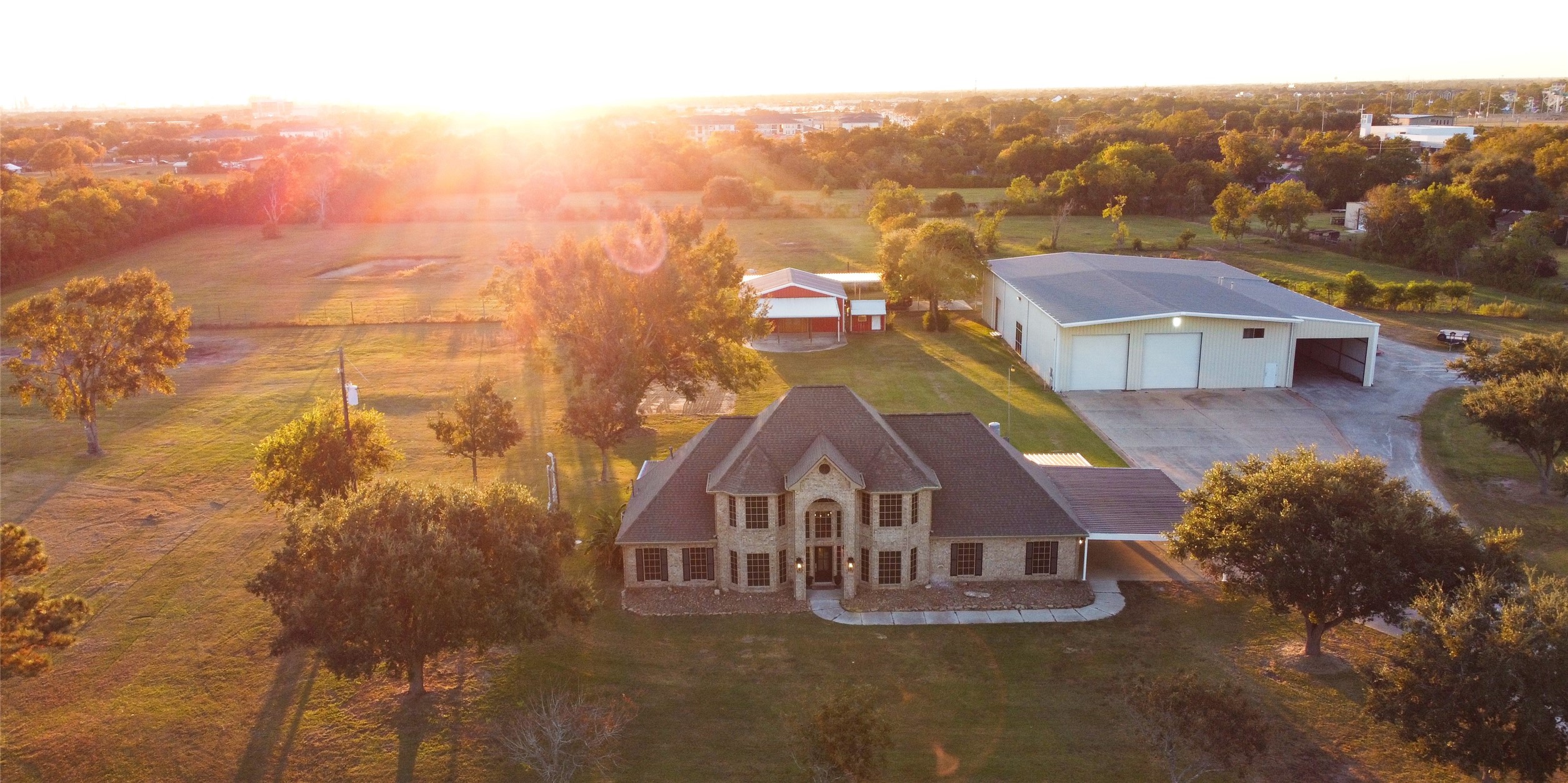 an aerial view of residential houses with city view