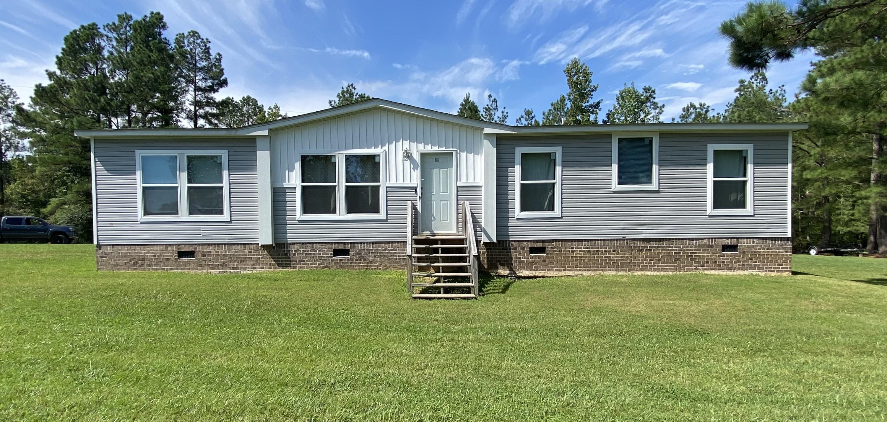 front view of a house with a yard