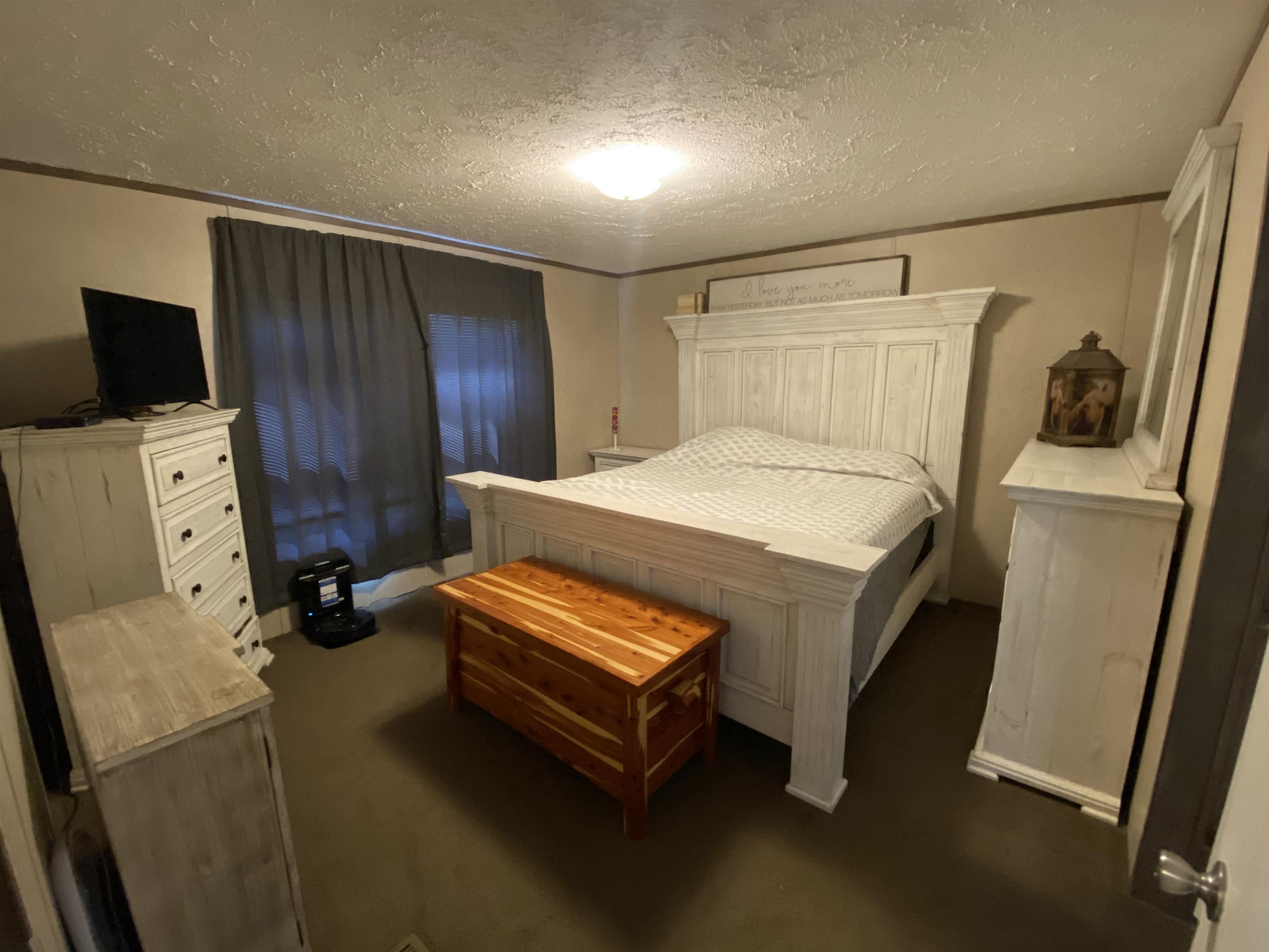 675 Humphrey Road Huntingdon, TN 38344 - Photo 19 of 25 a bedroom with a bed and flat screen tv