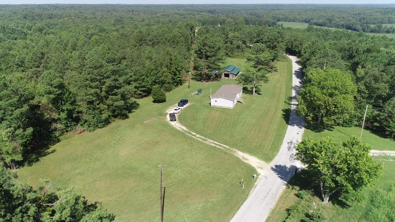 675 Humphrey Road Huntingdon, TN 38344 - Photo 2 of 25 an aerial view of a residential houses with outdoor space and trees all around
